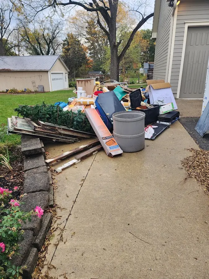 Dumpster being loaded with debris for Commercial Dumpster Rental in Laurens